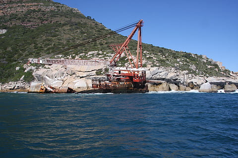 south africa, barges ship wreck, ocean, water, industry, transportation, nature, land, mining, machinery, sea, mountain, day, nautical vessel, environmental issues, environment, blue, outdoors, mode of transportation, business, ship, pollution, quarry, industrial equipment, air pollution, 4K, CC0, public domain, royalty free