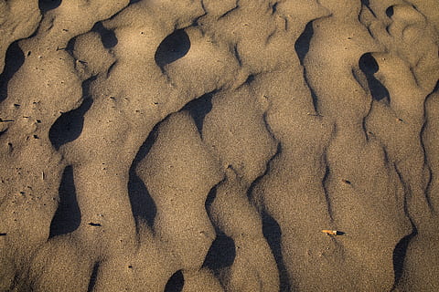 gray cave interior, footprint, outdoors, sand, soil, grey, land, beach, nature, high angle view, sunlight, day, full frame, no people, pattern, backgrounds, wet, water, shadow, tranquility, desert, textured, arid climate, 5K, CC0, public domain, royalty free