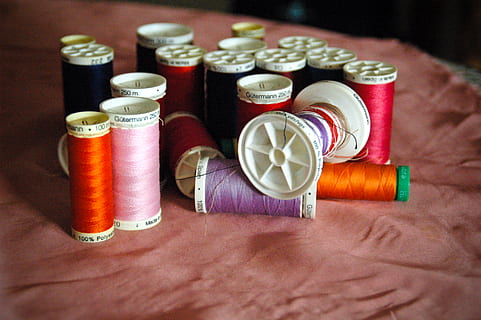 threads, sewing, coils, thread, indoors, multi colored, spool, choice, variation, close-up, large group of objects, art and craft, textile, still life, table, no people, group of objects, sewing item, in a row, high angle view, red, creativity, 8K, CC0, public domain, royalty free