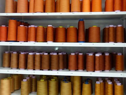 sewing thread, thread, sew, orange, brown, thread spool, no people, in a row, large group of objects, indoors, shelf, variation, choice, order, arrangement, close-up, industry, backgrounds, retail, full frame, education, side by side, man made object, man made, learning, 2K, CC0, public domain, royalty free