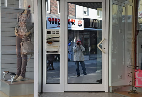 window, road, mirroring, facade, full length, real people, glass - material, entrance, reflection, lifestyles, adult, door, people, transparent, store, women, men, standing, representation, leisure activity, day, shopping, indoors, 4K, CC0, public domain, royalty free