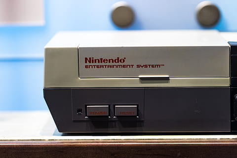 classic snes console, console, nintendo, cup, tech, technology, nes, button, system, design, classic, retro, gaming, bowl, nintento, nintendo entertainment system, indoors, equipment, machinery, close-up, no people, text, number, focus on foreground, communication, machine part, western script, knob, single object, push button, radio, accuracy, metal, domestic room, electrical equipment, 5K, CC0, public domain, royalty free