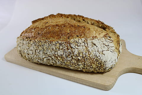 sourdough, multigrain, baker, food and drink, food, bread, freshness, wellbeing, indoors, no people, healthy eating, cutting board, close-up, still life, studio shot, baked, wood - material, loaf of bread, brown bread, white background, slice, single object, brown, dietary fiber, chopped, 4K, CC0, public domain, royalty free