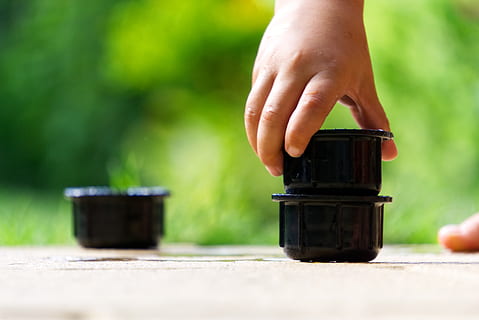 stack, play, cup, make, tower, build, child, child's hand, small child, art, stacked, building blocks, human hand, hand, one person, human body part, real people, container, selective focus, focus on foreground, day, wood - material, body part, holding, food and drink, lifestyles, human finger, finger, women, table, unrecognizable person, human limb, 5K, CC0, public domain, royalty free