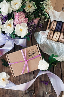 brown macarons box, plant, flower, blossom, flower arrangement, flower bouquet, geranium, basket, linen, home decor, box, gift, graphics, floral design, pattern, art, rose, petal, cushion, pillow, glass, flowering plant, beauty in nature, table, freshness, high angle view, paper, nature, celebration, ribbon, ribbon - sewing item, indoors, event, bouquet, decoration, close-up, gift box, no people, box - container, wrapping paper, flower head, 5K, CC0, public domain, royalty free