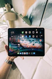 black ipad, tablet computer, electronics, computer, wristwatch, cushion, person, human, phone, cell phone, mobile phone, ipados, apple, ipad pro, device, apple devices, tablet, ios, ipad, face, screen, human hand, technology, communication, hand, wireless technology, portable information device, real people, smart phone, human body part, one person, photography themes, holding, photographing, personal perspective, unrecognizable person, lifestyles, activity, connection, finger, 5K, CC0, public domain, royalty free