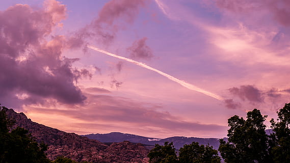 sky, clouds, sunset, cloud - sky, beauty in nature, mountain, tree, nature, vapor trail, scenics - nature, plant, environment, no people, mountain range, landscape, outdoors, dramatic sky, low angle view, pink color, idyllic, 5K, CC0, public domain, royalty free