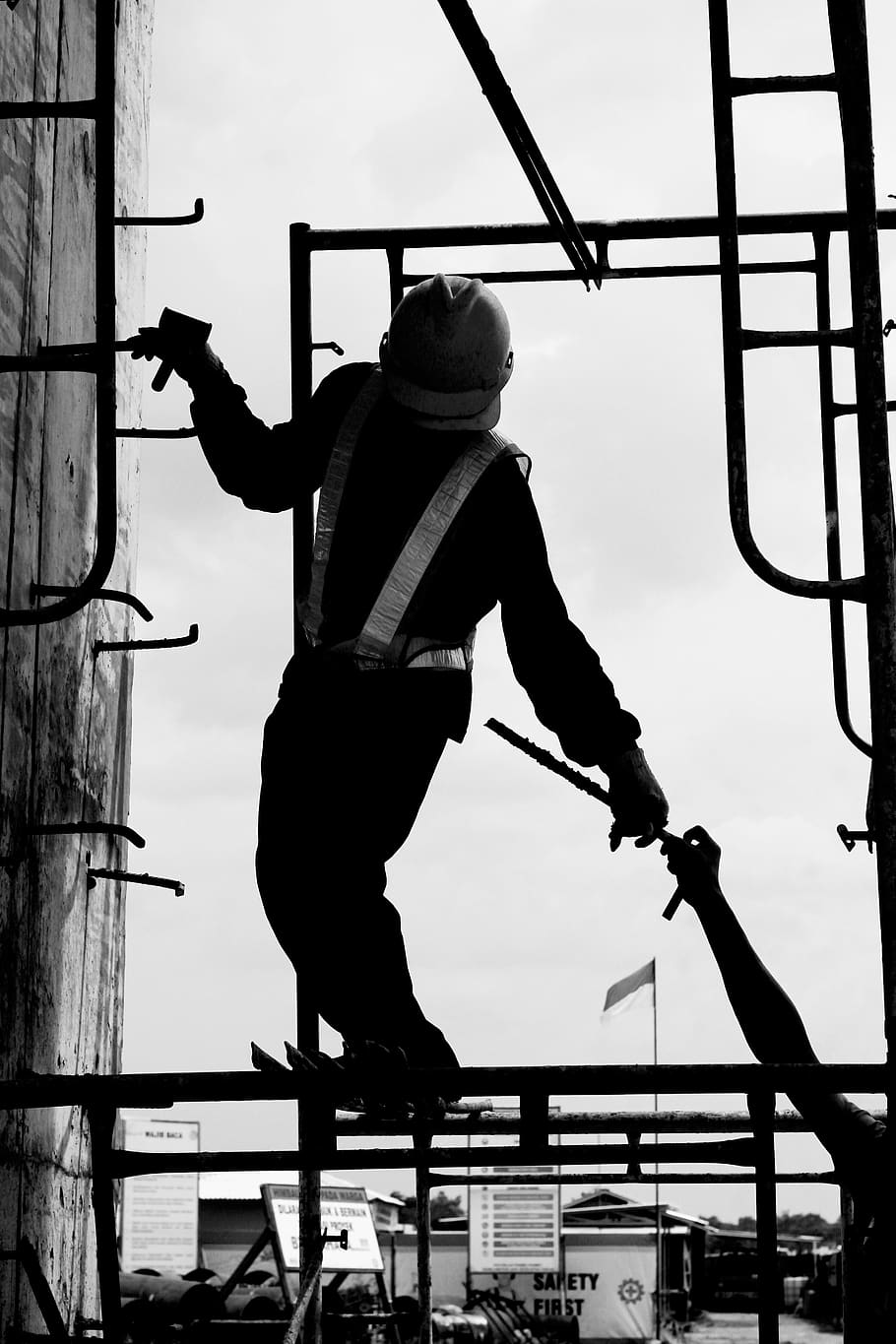 construction, worker, concrete, work, labor, task, build, development, iron, guy, equipment, climb, indonesian, black and white, real people, one person, full length, men, lifestyles, leisure activity, sky, architecture, day, standing, rear view, skill, performance, silhouette, casual clothing, holding, low angle view, sport, nature, human arm, arms raised, 5K