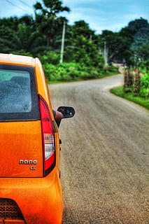 auto, nano, Indie, přeprava, způsob dopravy, silnice, motorové vozidlo, pozemního vozidla, strom, rostlina, zaměřit se na popředí, den, město, Příroda, oranžová barva, ulice, cestovat, venku, nikdo, žlutá, slunečního světla, nebe, výlet, kolo, 5K, CC0, veřejná doména, bez autorských práv