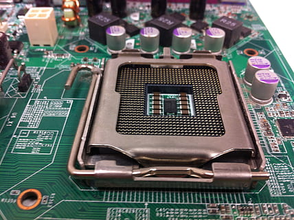 motherboard, cpu socket, computer, circuit board, technology, computer chip, electronics industry, computer equipment, close-up, connection, communication, industry, green color, no people, computer part, wireless technology, mother board, indoors, equipment, number, electrical equipment, complexity, cpu, networking, electrical component, 2K, CC0, public domain, royalty free