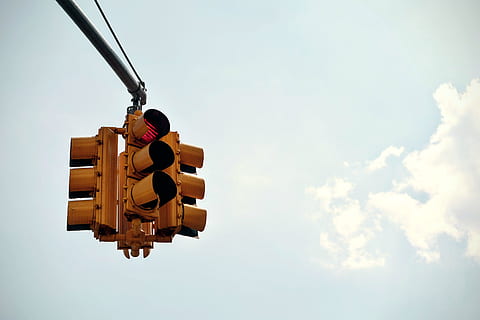 traffic, light, intersection, city, sky, clouds, sunshine, cloud - sky, nature, low angle view, stoplight, day, transportation, no people, road signal, sign, outdoors, safety, guidance, red light, direction, lighting equipment, signal, hanging, mode of transportation, 4K, CC0, public domain, royalty free