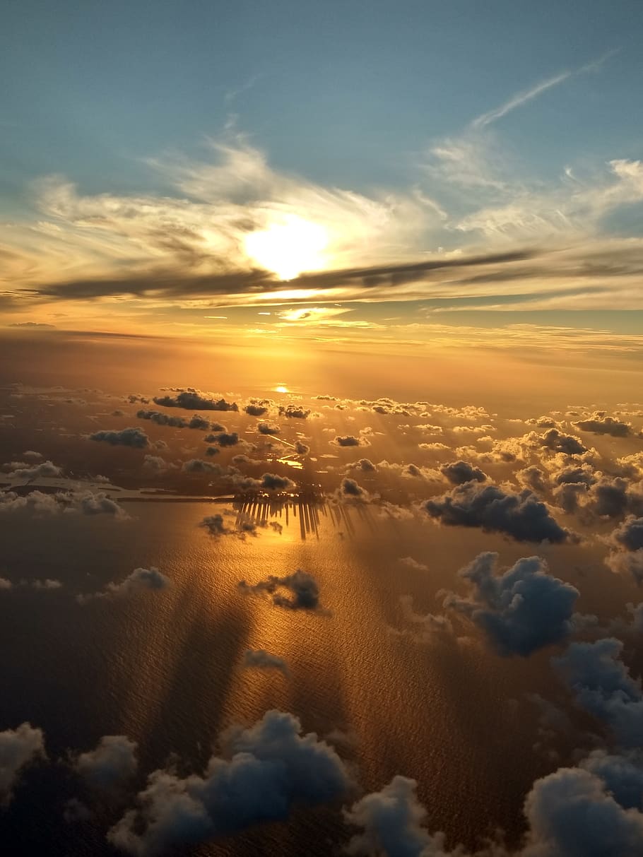 sunset, clouds, nature, sky, cloud - sky, scenics - nature, beauty in nature, tranquility, tranquil scene, no people, idyllic, cloudscape, orange color, aerial view, outdoors, sunlight, dramatic sky, environment, sun, landscape, fluffy, meteorology, 4K