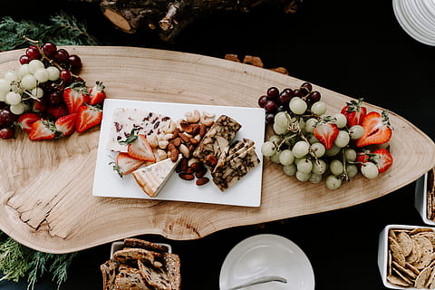 cooked, food, rectangular, tray, plant, fruit, grapes, furniture, dining table, table, strawberry, wood, bread, cracker, nuts, flat lay, crackers, appetizers, flatlay, cheese, almonds, chocolate, dessert, food and drink, healthy eating, freshness, wellbeing, high angle view, ready-to-eat, plate, no people, indoors, vegetable, still life, cutting board, dairy product, close-up, meat, serving size, 5K, CC0, public domain, royalty free
