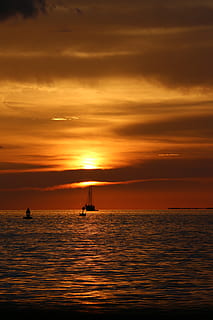 sunset, dusk, water, florida, sky, sea, cloud - sky, orange color, scenics - nature, transportation, nautical vessel, beauty in nature, waterfront, silhouette, mode of transportation, horizon over water, tranquil scene, nature, horizon, tranquility, idyllic, no people, outdoors, 5K, CC0, public domain, royalty free